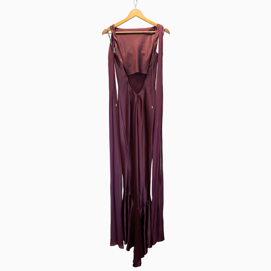 Maroon dress on a hanger against a white background