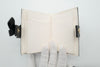 *Rare* CHANEL F/W 2022 Black Lambskin Mini Book Card Holder Light Gold Hardware 22B AP2953